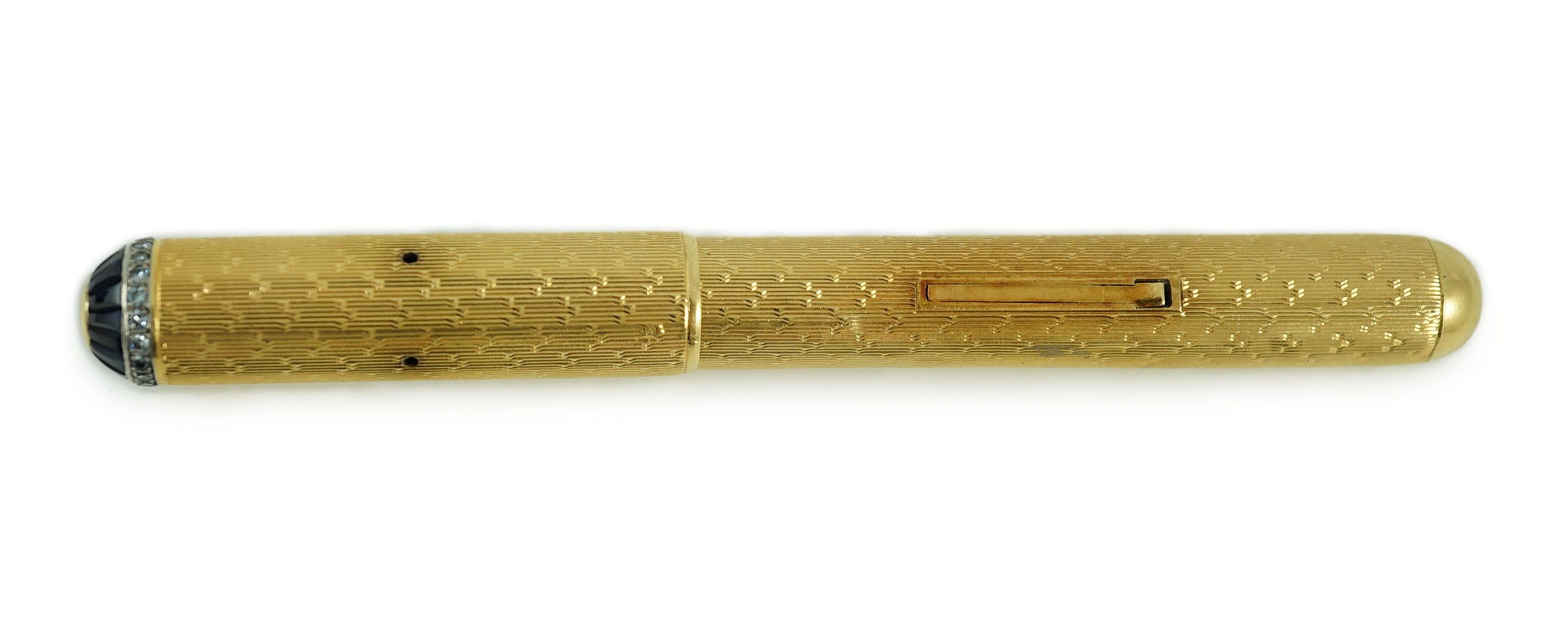 A late 1930's 18ct gold cased and sapphire and diamond set side lever fountain pen, 11cm